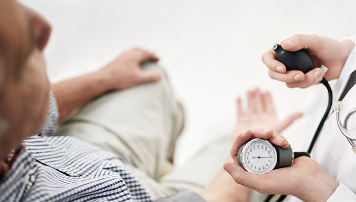 iStock-610449772-copy Doctor conducting blood pressure check